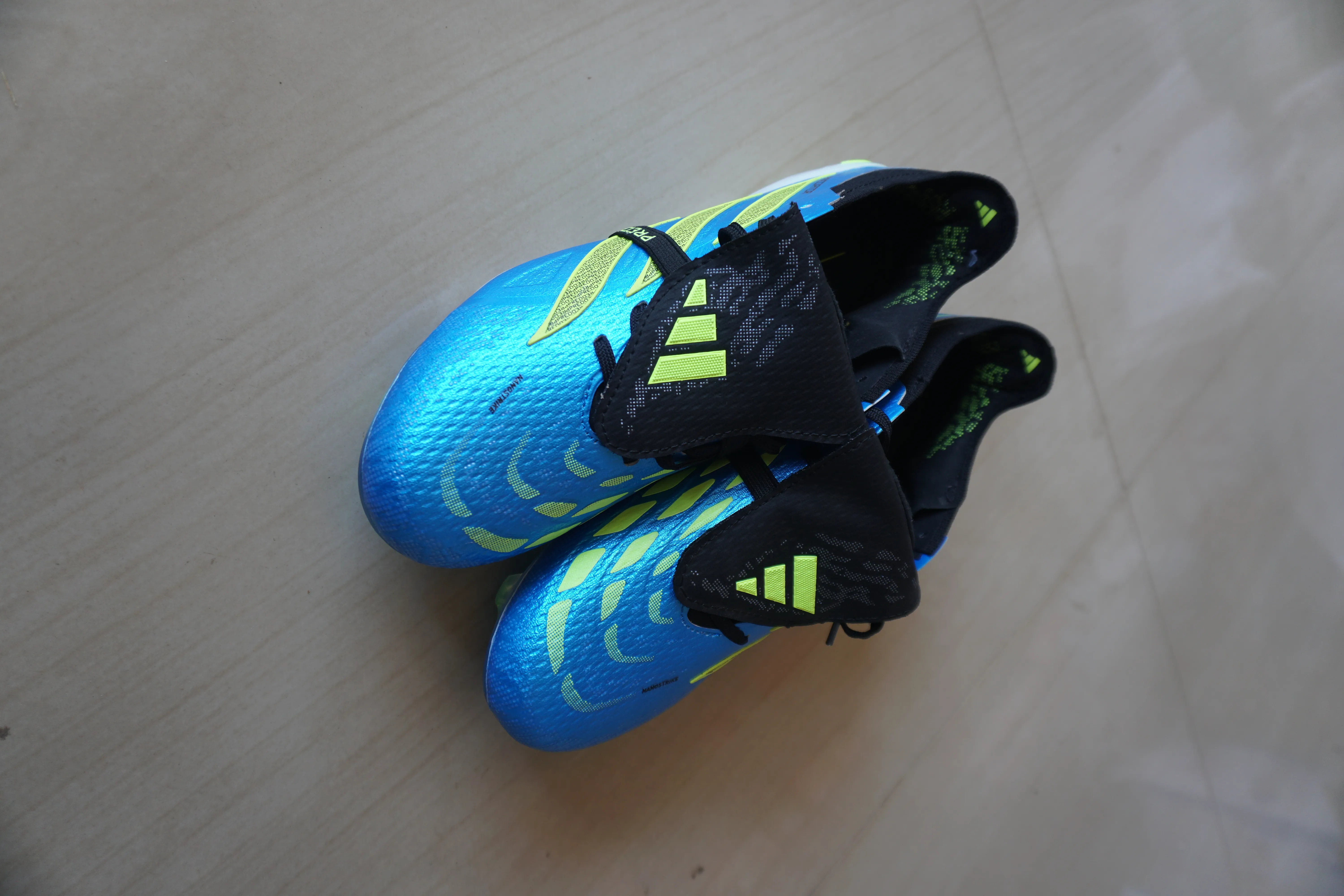 Adidas Predator Elite soccer cleats in a blue and neon yellow colorway